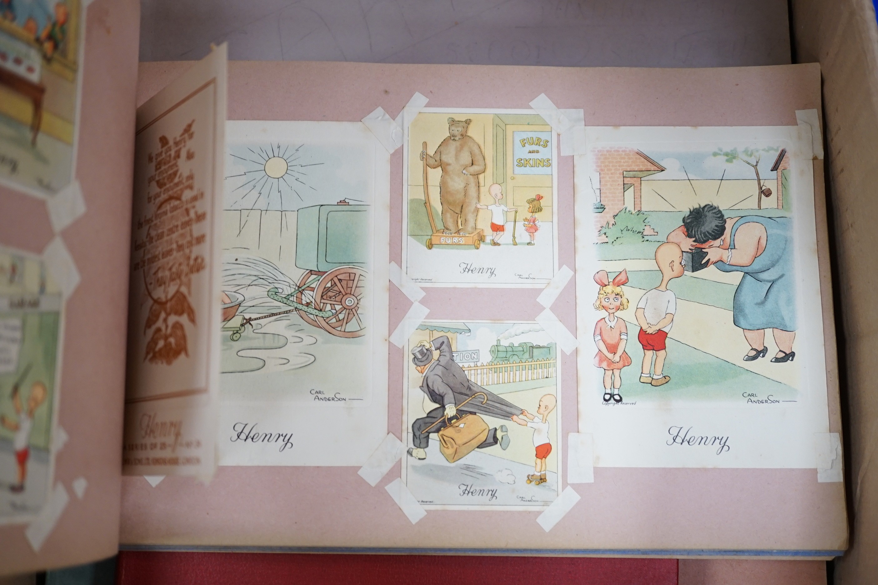 A ‘Henry’ postcard album, together with various Second World War cartoon/scrap books and political cartoons